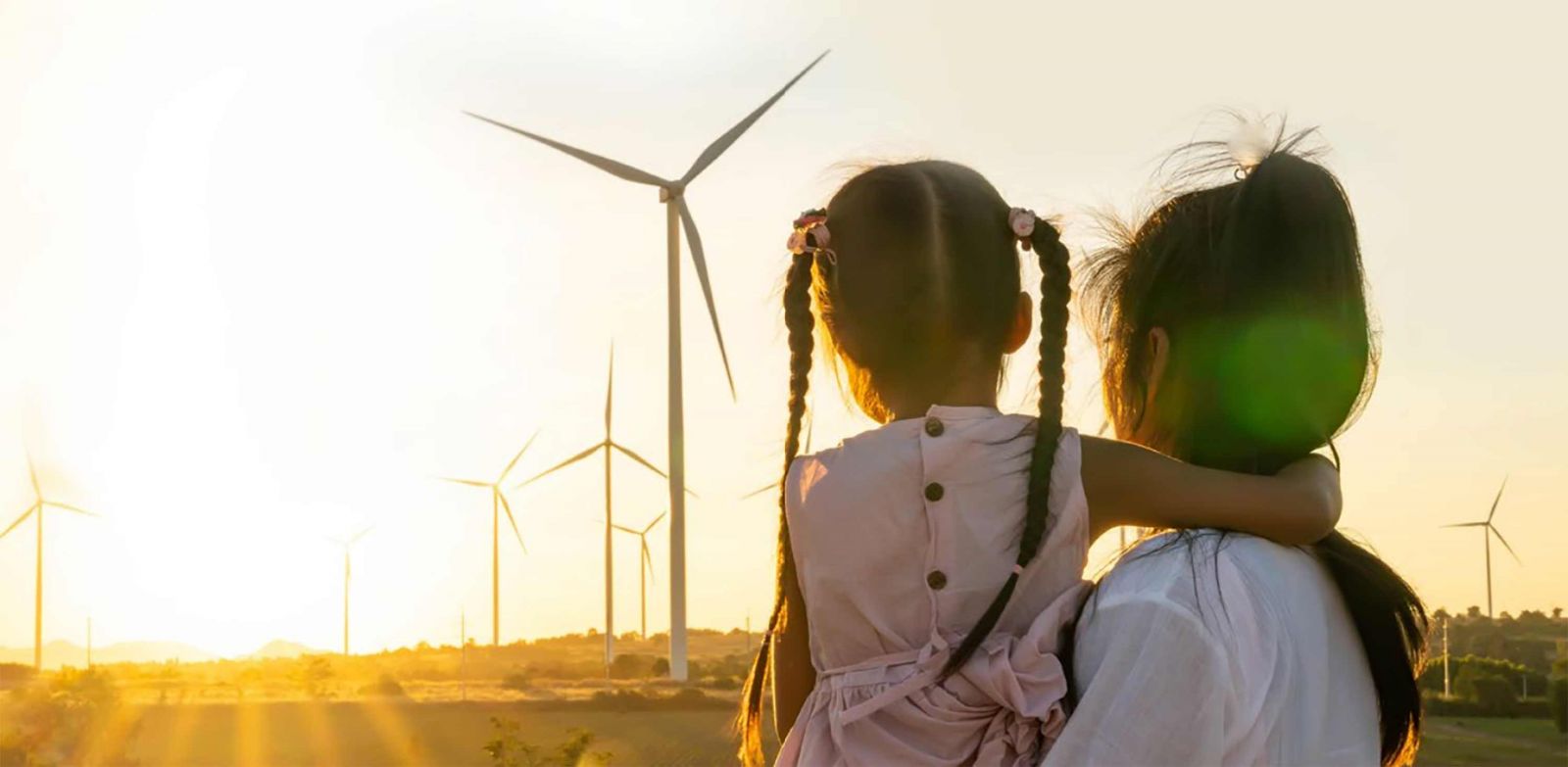 wind generation with mother and daughter looking on